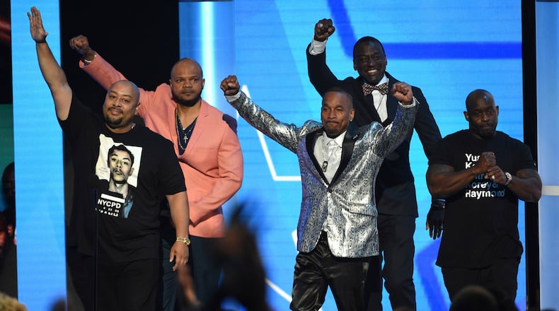 Raymond Santana Jr, from left, Kevin Richardson, Korey Wise, Yusef Salaam, and Antron McCray, also known as The Exonerated Five, introduce a performance by H.E.R. and YBN Cordae at the BET Awards on Sunday, June 23, 2019, at the Microsoft Theater in Los Angeles.