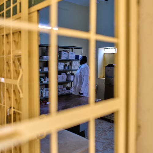 A staffer checks the pharmacy shelves at a public health clinic in Qoz Nafisa village, Khartoum state, Sudan, Wednesday, April 22, 2026. (AP Photo/Bernat Armangue)