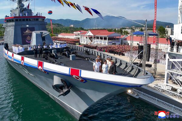 In this photo provided by the North Korean government, its leader Kim Jong Un, front right, and his daughter stand on a destroyer named Kang Kon during its launch ceremony at the Rajin shipyard in Rason, North Korea, Thursday, June 12, 2025. Independent journalists were not given access to cover the event depicted in this image distributed by the North Korean government. The content of this image is as provided and cannot be independently verified. Korean language watermark on image as provided by source reads: "KCNA" which is the abbreviation for Korean Central News Agency. (Korean Central News Agency/Korea News Service via AP)