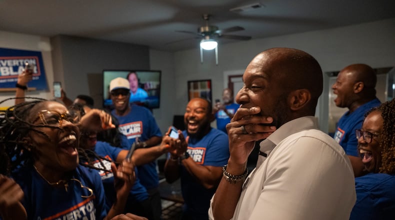 Adia Bryant (left) and former Gwinnett County Board of Education Chairman Everton Blair celebrate after Blair won the special election runoff for Georgia’s 13th Congressional District on Aug. 25, 2026. (Olivia Bowdoin for the AJC)