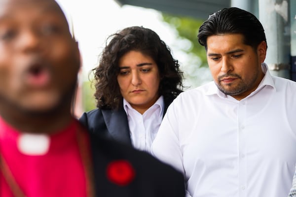 Atlanta City Councilmember Liliana Bakhtiari, center, and Old 4th Ward Business Association President Juan Mendoza at a press conference praying for an end to violence near Sweet Auburn at a MARTA station on Edgewood Avenue in Atlanta on Friday, August 1, 2025. (Abbey Cutrer/AJC)