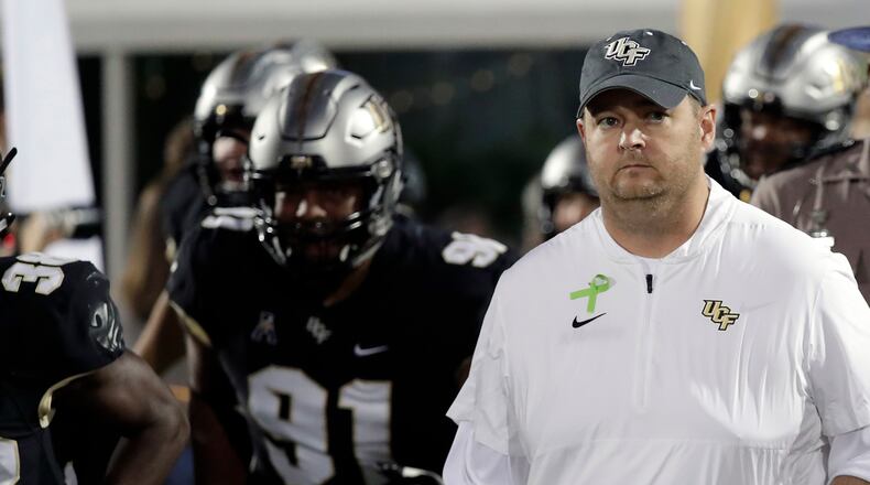 Central Florida head coach Josh Heupel takes the field with his players before the first half of a game against East Carolina Saturday, Oct. 19, 2019, in Orlando, Fla.
