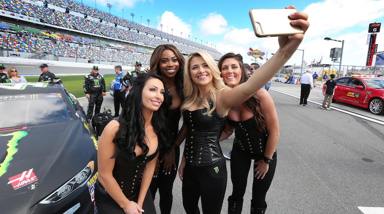The Monster Energy girls pose for a selfie on Pit Road before the Clash at Daytona NASCAR race on Sunday, Feb. 19, 2017, at Daytona International Speedway in Daytona Beach, Fla.