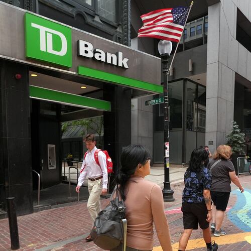 FILE - Pedestrians pass a TD Bank location, June 24, 2026, in Boston. (AP Photo/Charles Krupa, File)