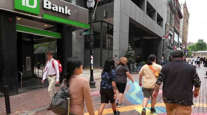 FILE - Pedestrians pass a TD Bank location, June 24, 2026, in Boston. (AP Photo/Charles Krupa, File)