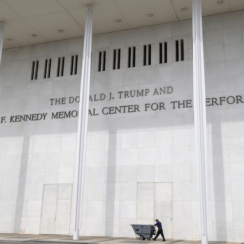 A man wheels a garbage bin outside of The John. F. Kennedy Center for the Performing Arts, Saturday, June 6, 2026, in Washington. (AP Photo/Rod Lamkey, Jr.)
