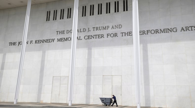 A man wheels a garbage bin outside of The John. F. Kennedy Center for the Performing Arts, Saturday, June 6, 2026, in Washington. (AP Photo/Rod Lamkey, Jr.)