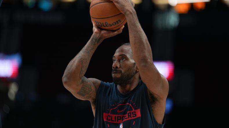 FILE - Los Angeles Clippers forward Kawhi Leonard warms up before an NBA basketball game April 10, 2026, in Portland, Ore. (AP Photo/Jenny Kane, File)