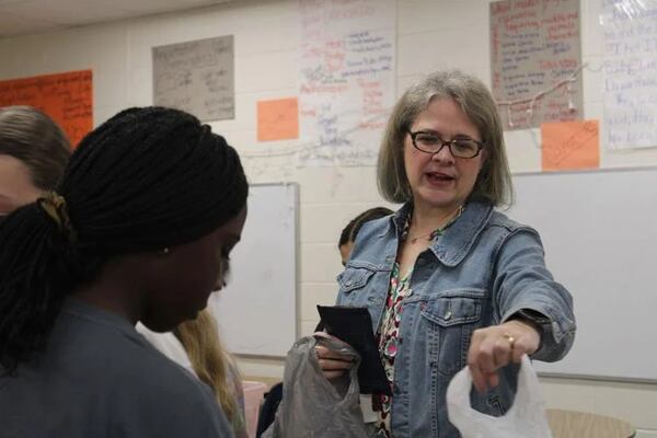 Sunny Williams is the 6th grade teacher at Dickerson Middle School who started the Pay It Forward club. Every Wednesday morning she leads students in efforts to support Atlanta Ronald McDonald Houses, make birthday signs for staff and participate in other acts of community service. (Photo Courtesy of Annie Mayne
/Marietta Daily Journal)