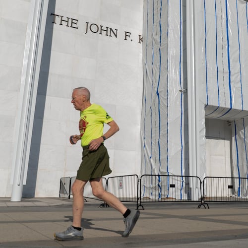 A person jogs outside of the John F. Kennedy Center for the Performing Arts on Wednesday, Sept. 16, 2026, in Washington. ( (AP Photo/Jose Luis Magana)