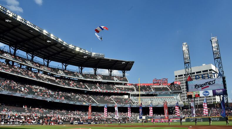 Military personnel drop into the stadium via parachute before the Atlanta Braves game against the St. Louis Cardinals in Game 1 at SunTrust Park on Thursday, October 3, 2019 in Atlanta. (Hyosub Shin / Hyosub.Shin@ajc.com)
