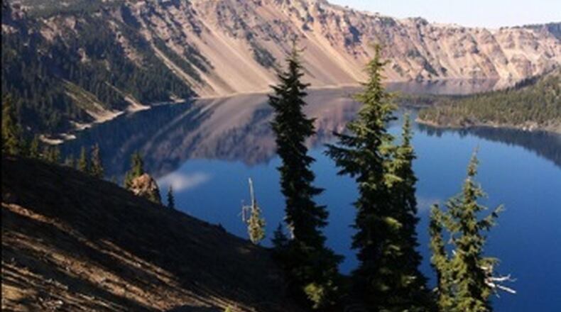 While visiting a friend in Oregon, Judy Cleveland took this photo of Crater Lake. “We took a drive out to southern Oregon so she could show me this beautiful wonder of the world!” she wrote. “I was in awe of its beauty and pretty darn proud of my camera phone pic.” Crater Lake is in the Cascade Mountains of southern Oregon. It was formed by the now-collapsed volcano, Mount Mazama. Wizard Island is a cinder cone near the western edge of the lake. The Rim Drive, a road surrounding the lake, offers views of the national park’s volcanic formations. The park’s numerous trails include Sun Notch, with views of the Phantom Ship, a small island.
