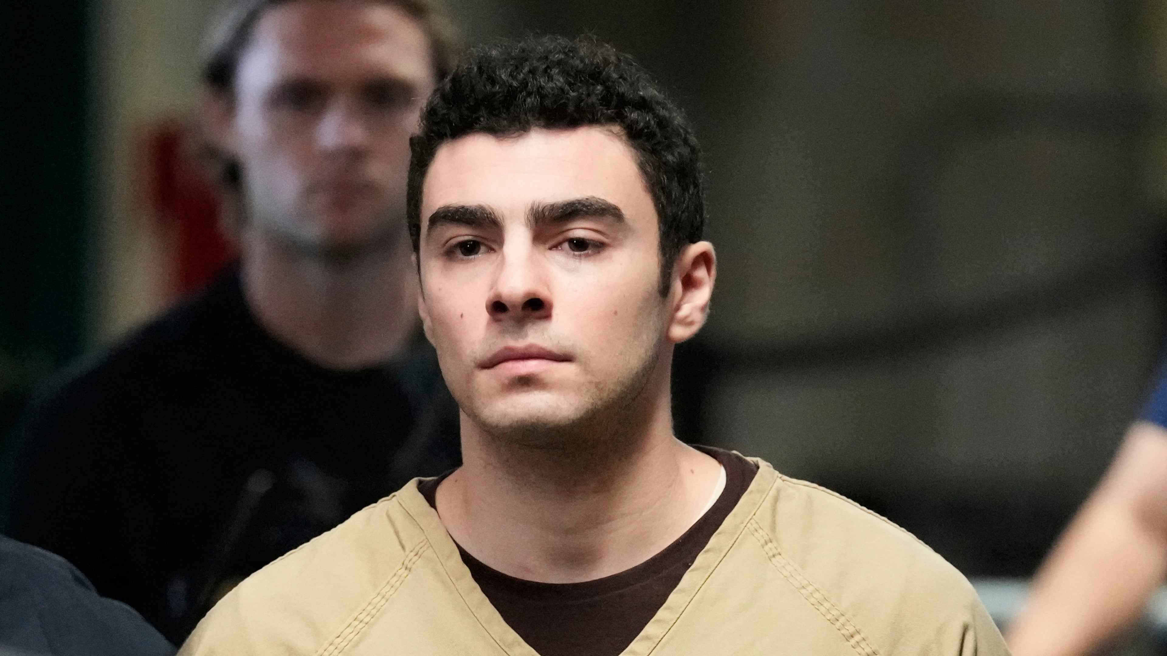 FILE - Luigi Mangione is escorted into Manhattan state court in New York, Sept. 16, 2025. (AP Photo/Seth Wenig, file)