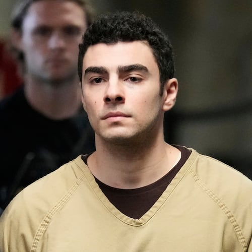 FILE - Luigi Mangione is escorted into Manhattan state court in New York, Sept. 16, 2025. (AP Photo/Seth Wenig, file)