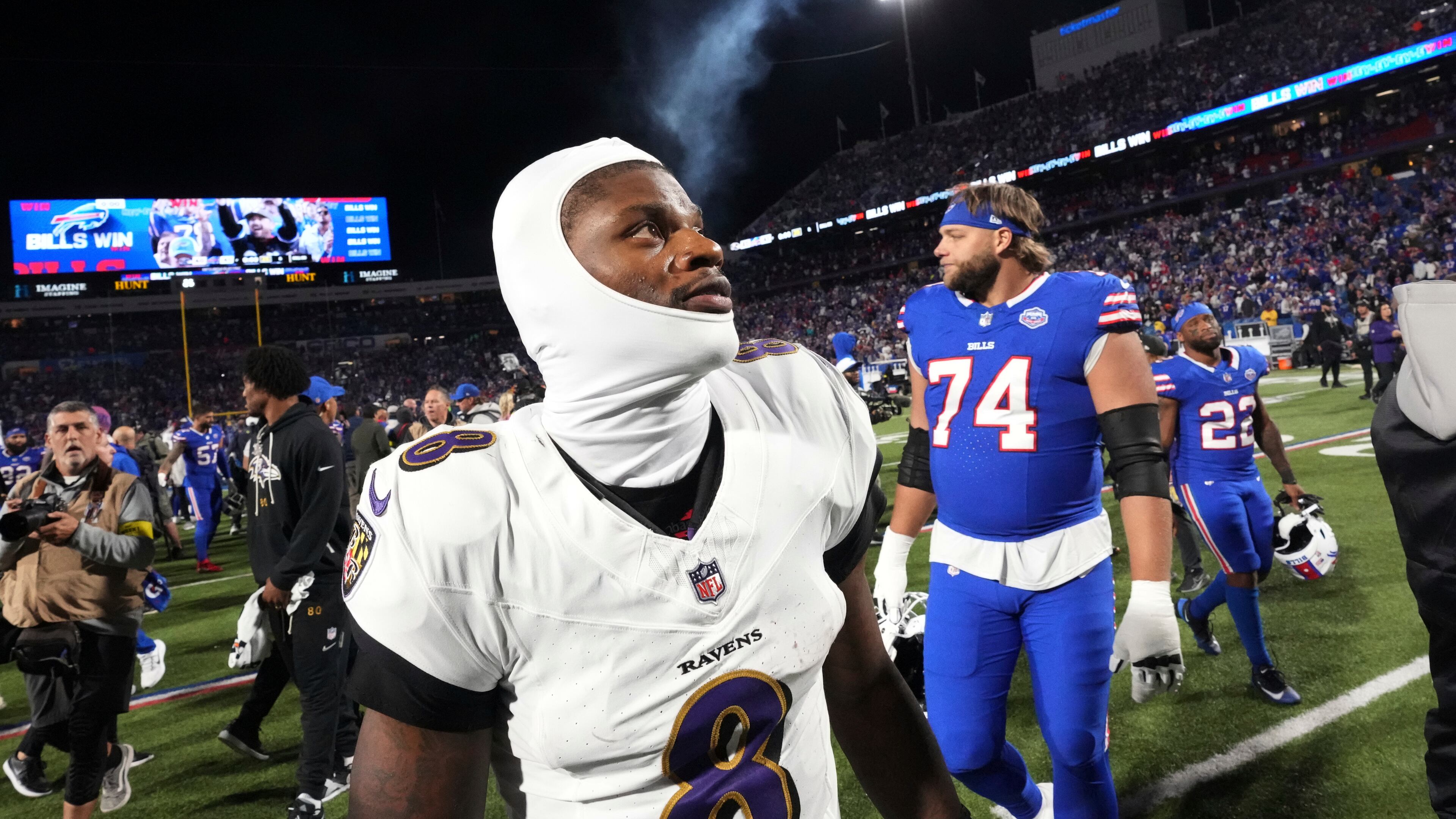 Baltimore Ravens quarterback Lamar Jackson (8) walks off the field after the team's loss to the Buffalo Bills in an NFL football game in Orchard Park, N.Y., Sunday, Sept. 7, 2025. (AP Photo/Gene J. Puskar)