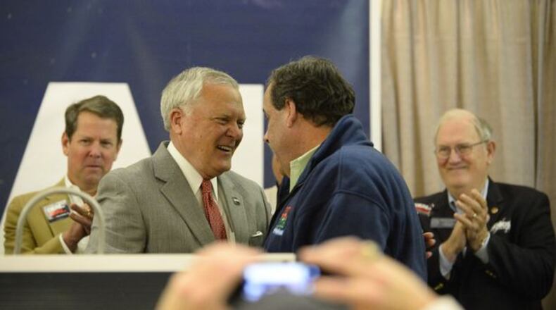 Gov. Nathan Deal and Gov. Chris Christie greet each other in Gainesville. AP Photo