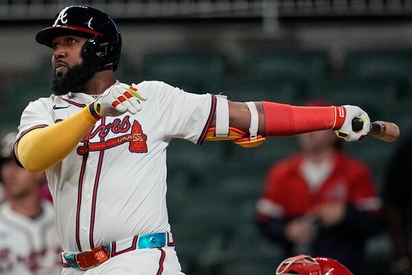 Atlanta Braves designated hitter Marcell Ozuna (20) hits a walk-off two-run homer in the 11th inning of a baseball game after a rain delay against the Philadelphia Phillies, Friday, April 11, 2025, in Atlanta. (AP Photo/Mike Stewart)