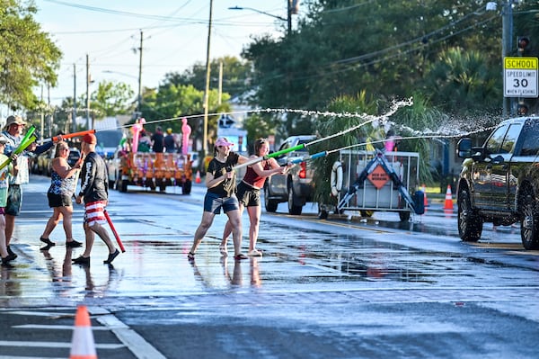 Tybee Island has plenty of parades. The Beach Bum Parade ahead of Memorial Day is definitely the wettest. (Sarah Peacock for the AJC)
