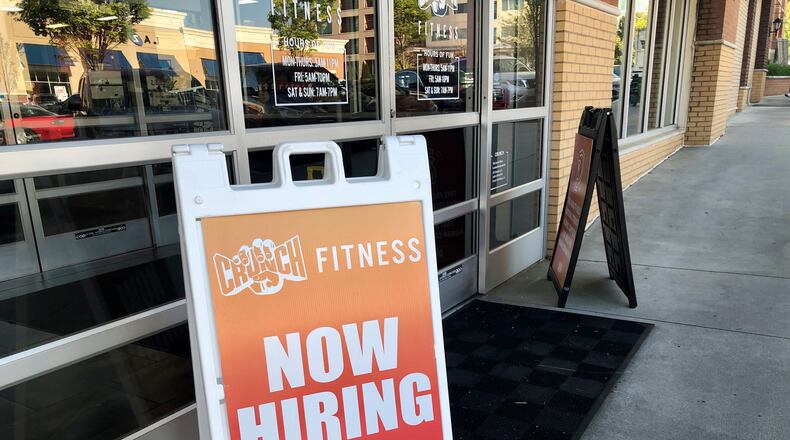 Signs advertise openings at a Crunch Fitness gym in Dunwoody on Thursday, April 21, 2022. J. SCOTT TRUBEY