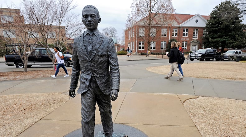 The James Meredith statue is seen on the University of Mississippi campus in Oxford, Miss., Monday, Feb. 17, 2014. A $25,000 reward is available for information leading to the arrest of two men involved in sullying the statue early Sunday, Feb. 16. (AP Photo/The Daily Mississippian, Thomas Graning)