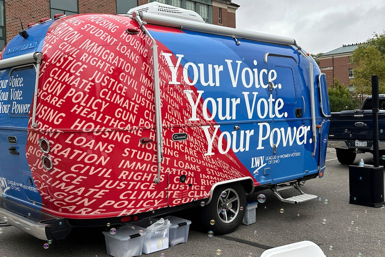 Thanks to activists a century ago, women earned the right to vote in 1920, and groups like the League of Women Voters — here working to register student voters in Ohio in 2024 — have continued to advocate for women's equality. (Julie Carr Smyth/AP 2024)