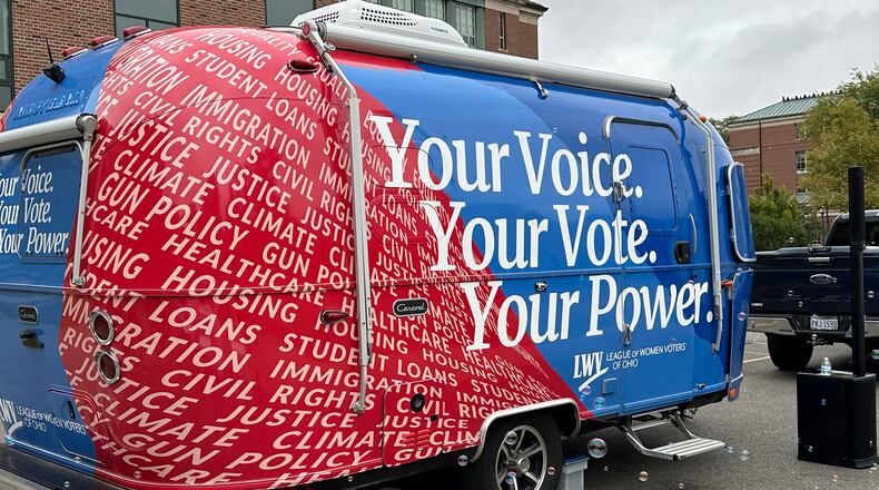 Thanks to activists a century ago, women earned the right to vote in 1920, and groups like the League of Women Voters — here working to register student voters in Ohio in 2024 — have continued to advocate for women's equality. (Julie Carr Smyth/AP 2024)