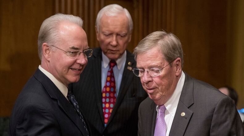 Health and Human Services Secretary nominee Tom Price, R-Ga., left, arrives with Senate Finance Committee Chairman Sen. Orrin Hatch, R-Utah, center, and Sen. Johnny Isakson, R-Ga., on Capitol Hill at Price’s confirmation hearing in January. AP/Andrew Harnik