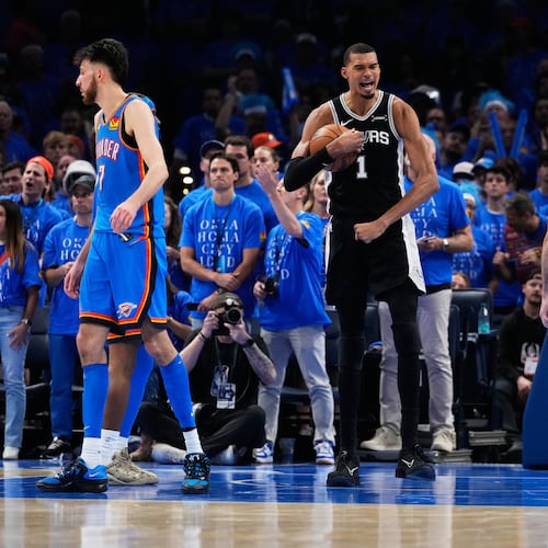 San Antonio Spurs forward Victor Wembanyama (1) celebrates after a dunk during the second overtime of Game 1 in a third-round NBA basketball playoffs series against the Oklahoma City Thunder Monday, May 18, 2026, in Oklahoma City. (AP Photo/Tony Gutierrez)