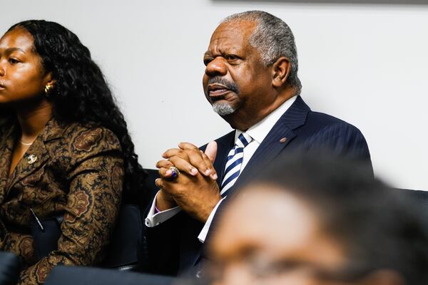 Former Commissioner David Burgess listens during a Georgia PSC meeting in Atlanta. In 2000, he became the commission’s first Black member since its inception in 1879. He wanted to congratulate Commissioner Johnson. (Abbey Cutrer/AJC)