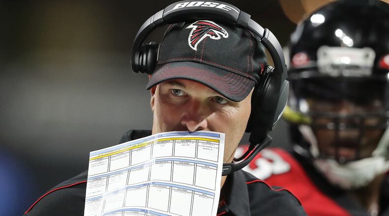 Falcons head coach Dan Quinn calls a defense against the Washington Redskins. Curtis Compton/ccompton@ajc.com