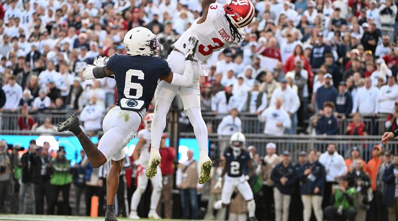 Indiana wide receiver Omar Cooper Jr. (3) catches a touchdown pass over Penn State safety Zakee Wheatley (6) during the fourth quarter of an NCAA college football game, Saturday, Nov. 8, 2025, in State College, Pa. (AP Photo/Barry Reeger)