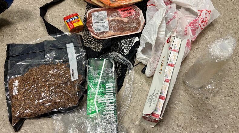 In this undated photo released by the South Carolina Department of Corrections, items dropped by a drone into the Lee Correctional Institution in Bishopville, S.C., are seen. (South Carolina Department of Corrections via AP)