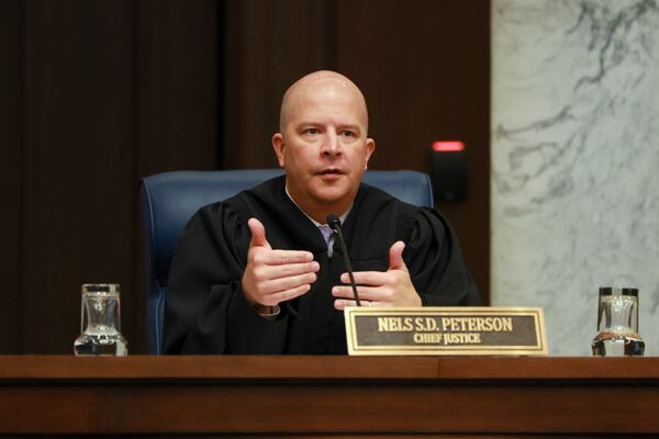 Georgia Supreme Court Chief Justice Nels Peterson, pictured during oral arguments in June, said letting most murder appeals go to the Georgia Court of Appeals will be more efficient. (Jason Getz/AJC)