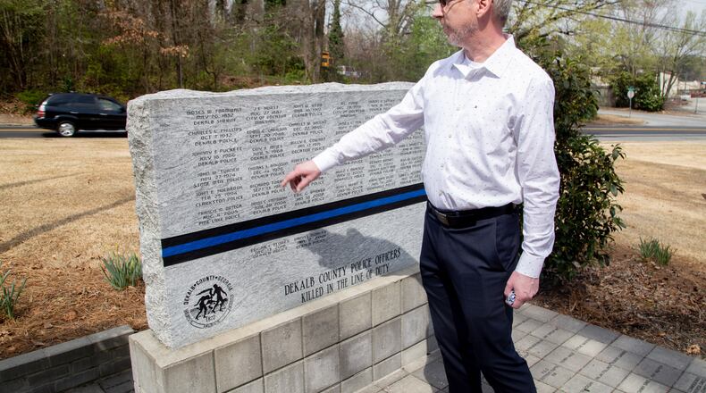 City Councilman Brian Mock talks about the Dekalb County Police Officers Killed in the Line of Duty memorial near Dresden Park in Chamblee on March 14, 2021. STEVE SCHAEFER FOR THE ATLANTA JOURNAL-CONSTITUTION