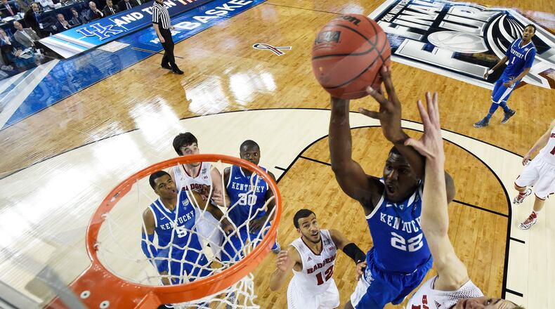 during the NCAA Men's Final Four Semifinal at AT&T Stadium on April 5, 2014 in Arlington, Texas. ARLINGTON, TX - APRIL 05: Alex Poythress #22 of the Kentucky Wildcats goes up for a shot as Sam Dekker #15 of the Wisconsin Badgers defends during the NCAA Men's Final Four Semifinal at AT&T Stadium on April 5, 2014 in Arlington, Texas. (Photo by Chris Steppig-Pool/Getty Images)