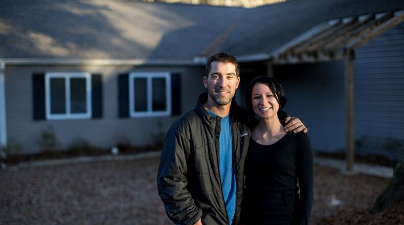 Andrew and Sarah Oliver pose for a photo at their new home, Wednesday, Dec. 14, 2016, in Acworth, Ga. Branden Camp/Special