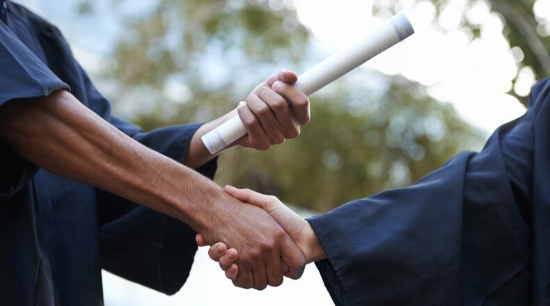 Cropped shot of a graduate receiving a degree