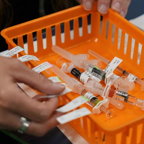FILE - Vaccines are prepared for students during a pop-up immunization clinic at a school in Louisville, Ky., on Thursday, Aug. 8, 2024. (AP Photo/Mary Conlon, File)