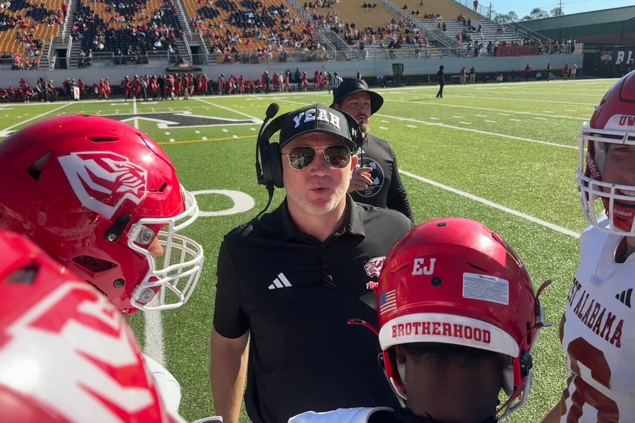 Scott Cochran (center), nicknamed "Coach Yeah," recently finished in his first season coaching West Alabama after drug addiction halted his SEC coaching career. (Jack Leo/AJC)