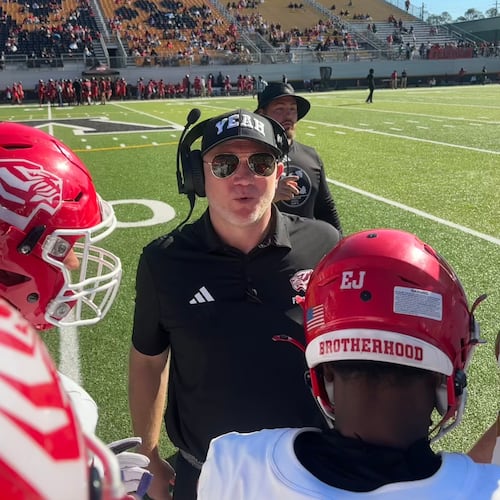 Scott Cochran (center), nicknamed "Coach Yeah," recently finished in his first season coaching West Alabama after drug addiction halted his SEC coaching career. (Jack Leo/AJC)