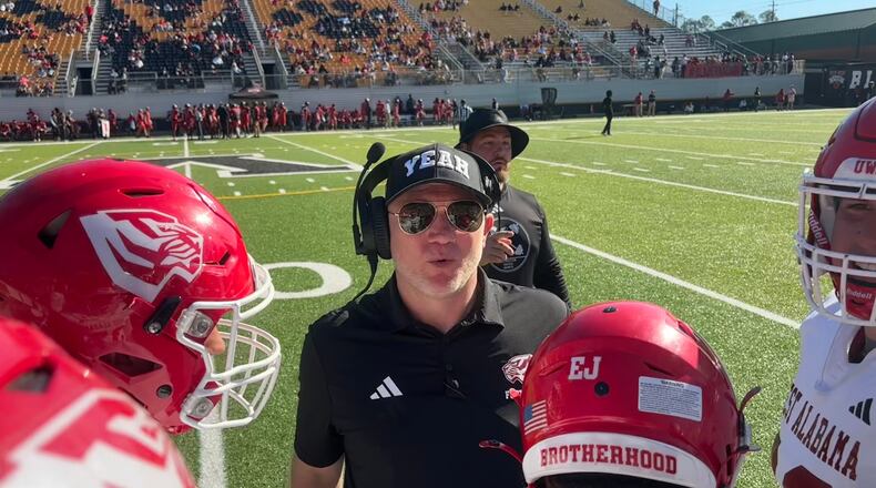 Scott Cochran (center), nicknamed "Coach Yeah," recently finished in his first season coaching West Alabama after drug addiction halted his SEC coaching career. (Jack Leo/AJC)