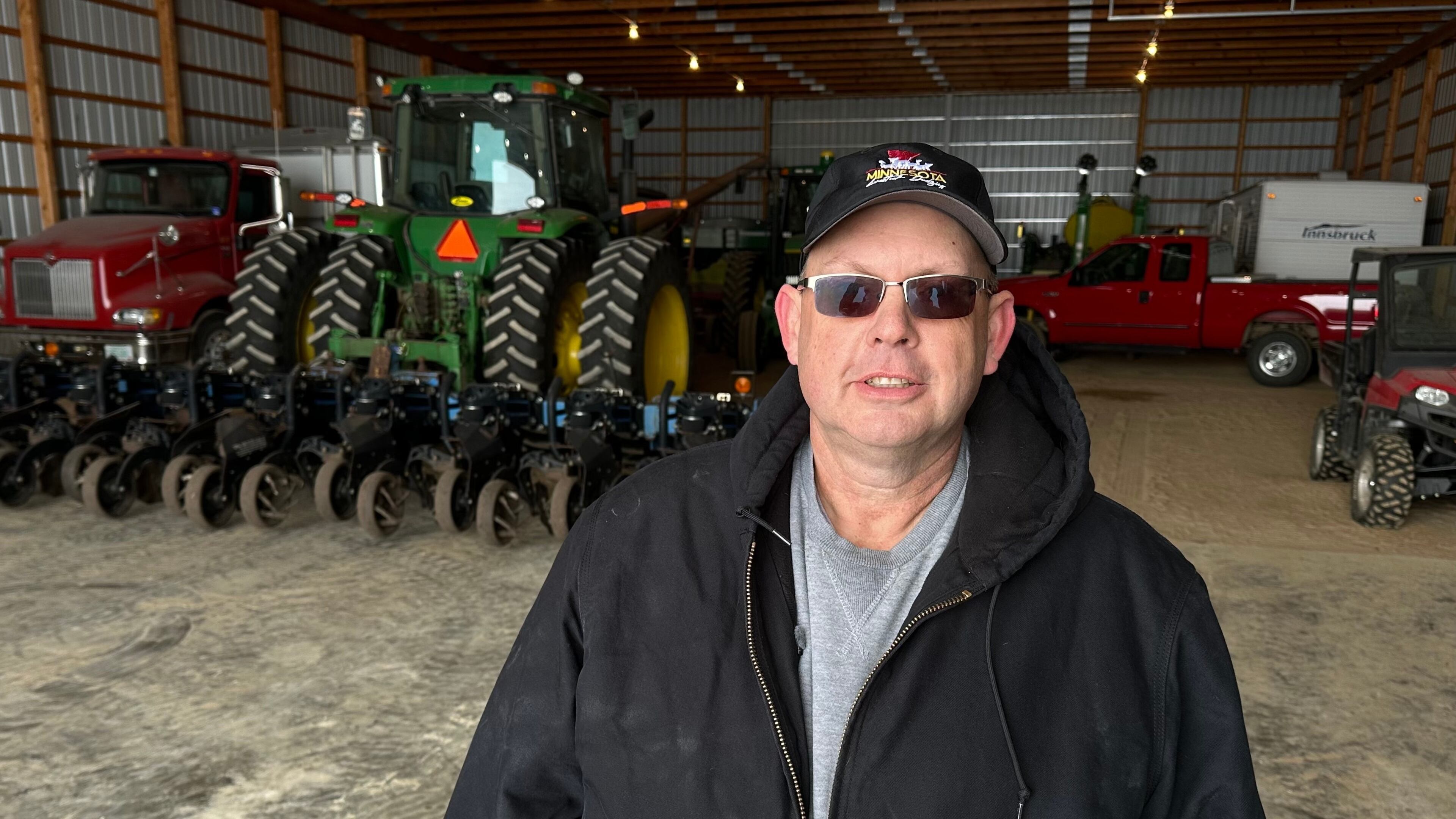 Charlie Radman, a corn and soybean farmer, stands for a photo on the land his family has owned since 1899, near Randolph, Minn., Wednesday, Dec. 10, 2025. (AP Photo/Mark Vancleave)
