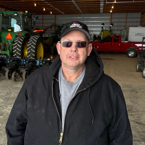 Charlie Radman, a corn and soybean farmer, stands for a photo on the land his family has owned since 1899, near Randolph, Minn., Wednesday, Dec. 10, 2025. (AP Photo/Mark Vancleave)