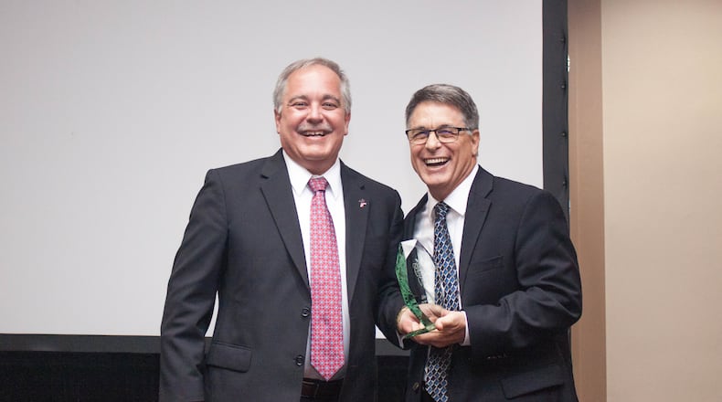 John R. Tibbetts (right), with Georgia Superintendent Richard Woods, when Tibbetts was named 2018 teacher of the year.