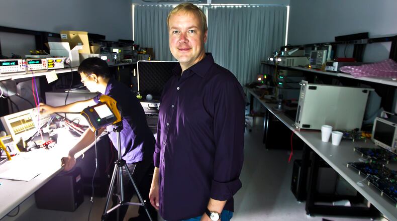 Ricardo B. Brazziell/American-Statesman 8/28/12 Cirrus Logic CEO Jason Rhodes poses at the downtown Austin, Texas headquarters on Tuesday, Aug.28, 2012.