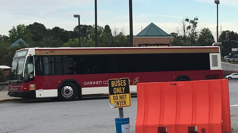 A Gwinnett County Transit bus sits at the transit center near Gwinnett Place Mall in 2020. TYLER ESTEP / TYLER.ESTEP@AJC.COM