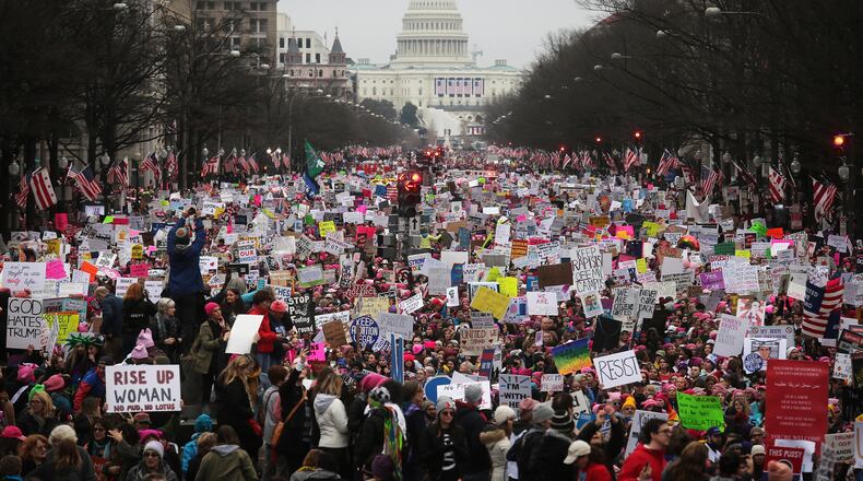 WASHINGTON, DC - JANUARY 21: Protesters walk up Pennsylvania Avenue during the Women's March on Washington, with the U.S. Capitol in the background, on January 21, 2017 in Washington, DC. The Indianapolis Star reported that Sen. Jack E. Sandlin shared a Facebook post calling particpants "fat women." (Photo by Mario Tama/Getty Images)