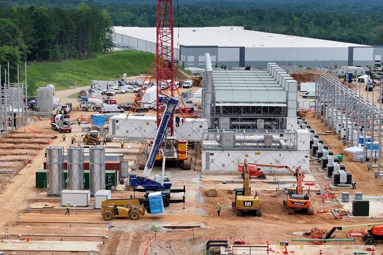 Aerial view of off-grid generators being installed, with the data center in the background, on Thursday, June 25, 2026, in Covington. A data center plans to get its primary power supply from a set of off-grid generators, the first setup of its kind in Georgia. (Hyosub Shin/AJC)