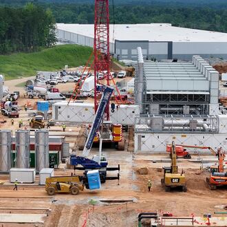 Aerial view of off-grid generators being installed, with the data center in the background, on Thursday, June 25, 2026, in Covington. A data center plans to get its primary power supply from a set of off-grid generators, the first setup of its kind in Georgia. (Hyosub Shin/AJC)
