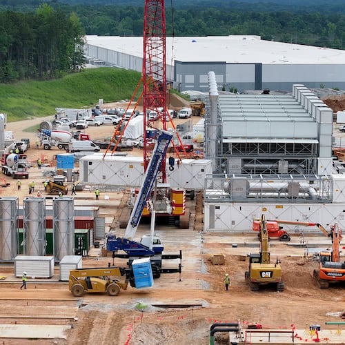 Aerial view of off-grid generators being installed, with the data center in the background, on Thursday, June 25, 2026, in Covington. A data center plans to get its primary power supply from a set of off-grid generators, the first setup of its kind in Georgia. (Hyosub Shin/AJC)